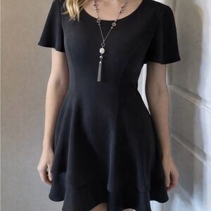 Black Randi May Dress Size 8P Peplum bottom, tie back.